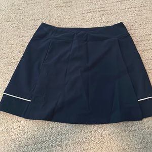 Oakley. Navy blue golf skirt. XS NWT